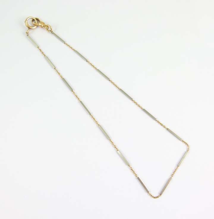 Platinum baton link and gold tracelink chain necklace, the batons of square section